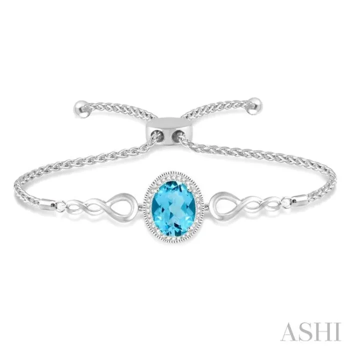 10×8 MM Oval Shape Blue Topaz and 1/20 Ctw Round shape Diamond Sterling Silver Lariat Bracelet