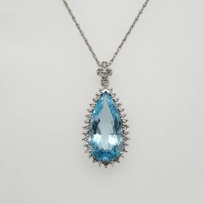 14kt White Gold Blue Topaz and Diamond Pendant Necklace