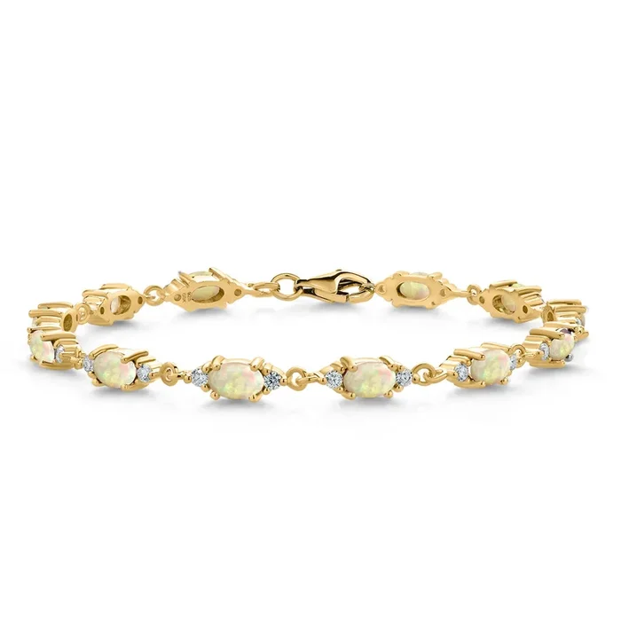 18K Yellow Gold Plated Silver White Ethiopian Opal and White Moissanite Tennis Bracelet For Women (4.75 Cttw, Gemstone Birthstone, Oval/Cabochon 6X4MM, 6.5, 7, 7.5 Inch)
