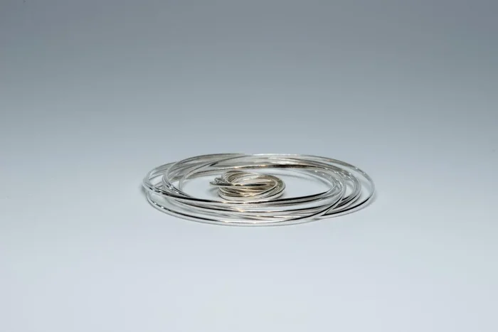 7 Interlinked Sterling Silver Bangles