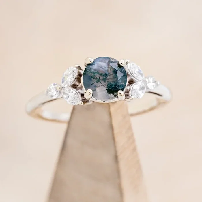 “BLOSSOM” – ROUND CUT MOSS AGATE ENGAGEMENT RING WITH DIAMOND ACCENTS