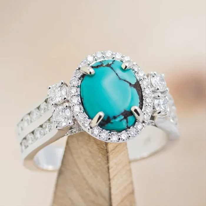 “FANCY” – OVAL CABOCHON CUT TURQUOISE ENGAGEMENT RING WITH DIAMOND HALO & ACCENTS