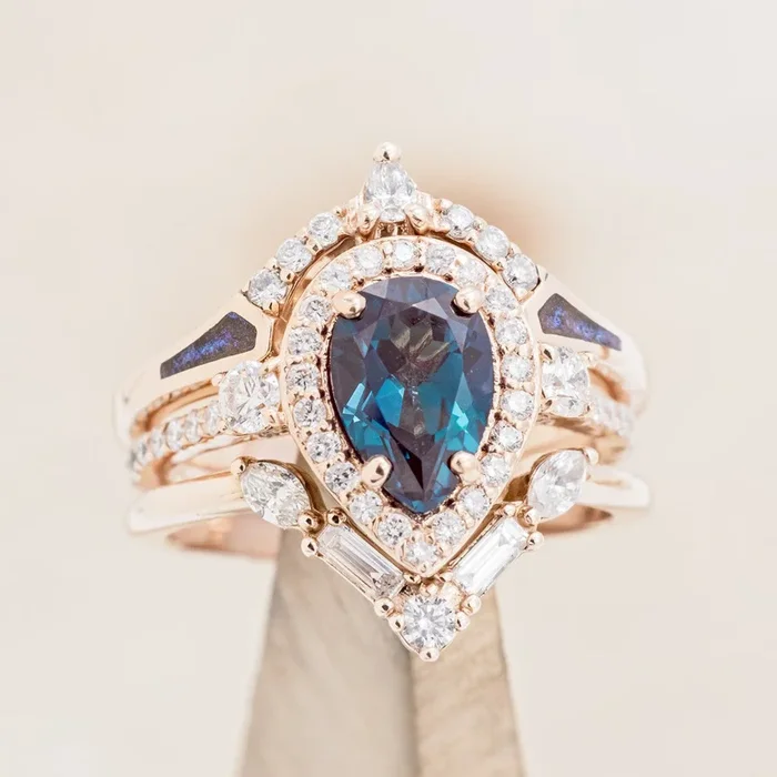 “KB” – BRIDAL SUITE – PEAR CUT LAB-GROWN ALEXANDRITE RING WITH A COSMIC ACRYLIC “SAMA” & DIAMOND “MELODY” TRACERS