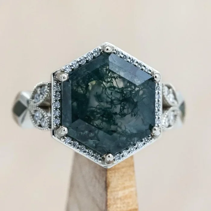 “LUCY IN THE SKY” – HEXAGON CUT MOSS AGATE ENGAGEMENT RING WITH DIAMOND HALO & MOSS INLAYS
