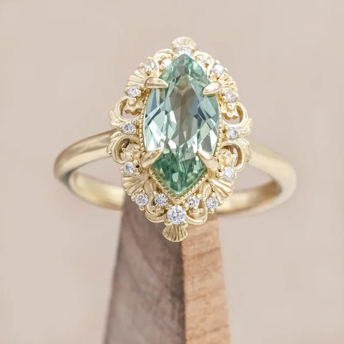 “MERROW” – MARQUISE CUT LAB-GROWN GREEN SAPPHIRE ENGAGEMENT RING WITH DIAMOND ACCENTS