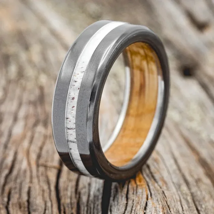 “NIRVANA” – ANTLER WEDDING RING FEATURING A WHISKEY BARREL LINED BAND – BLACK ZIRCONIUM – SIZE 9 1/4