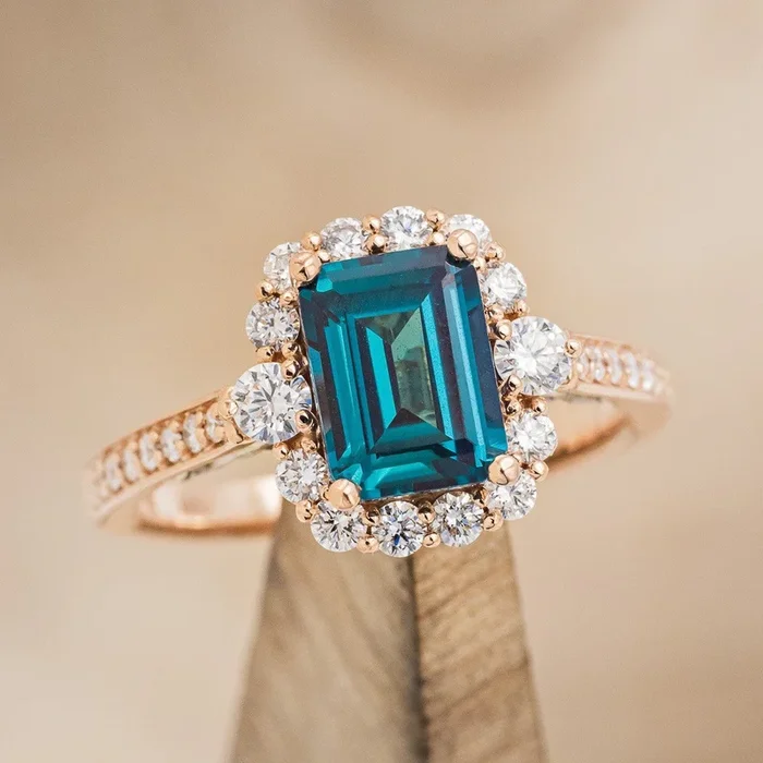 “OPHELIA” – EMERALD CUT LAB-GROWN ALEXANDRITE ENGAGEMENT RING WITH DIAMOND HALO & ACCENTS
