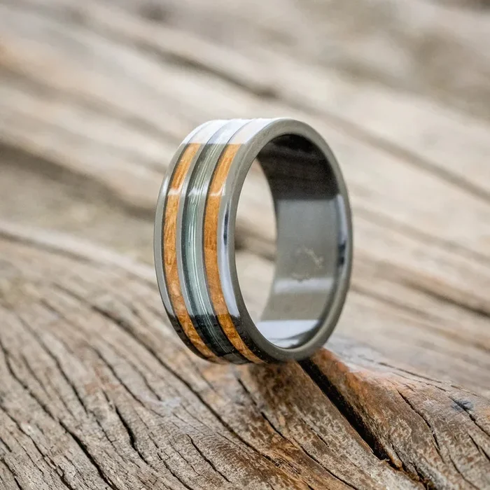 “RIO” – GREEN MONO FISHING LINE AND WHISKEY BARREL OAK WEDDING BAND – BLACK ZIRCONIUM – SIZE 11 1/4