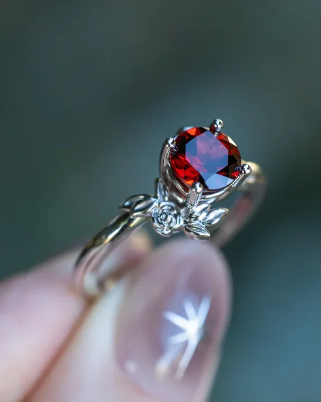 “ROSA” – ROUND CUT MOZAMBIQUE GARNET ENGAGEMENT RING WITH FLOWER ACCENTS – 14K WHITE GOLD – SIZE 6 3/4