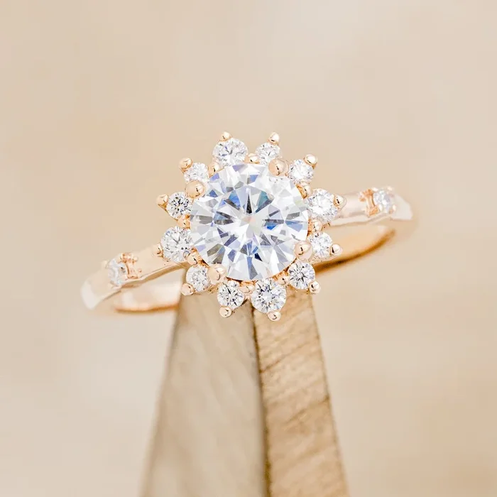 “STARLET” – ROUND CUT MOISSANITE ENGAGEMENT RING WITH STARBURST DIAMOND HALO