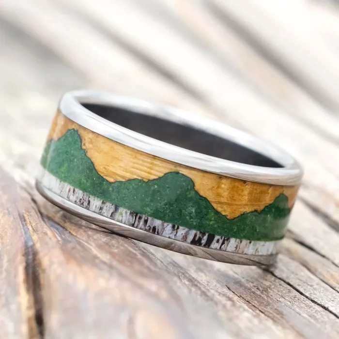 “VOYAGER” – WEDDING RING WITH WHISKEY BARREL OAK, MOSS-FILLED MOUNTAINS & ANTLER