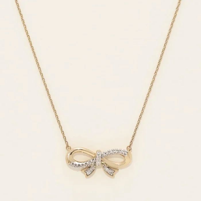 Diamond Bowtie Necklace in Sterling Silver with Yellow Gold Plating (1/10ct tw)