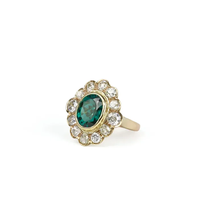 Estate 18 Karat Yellow Gold Oval Tourmaline and Diamond Halo Ring
