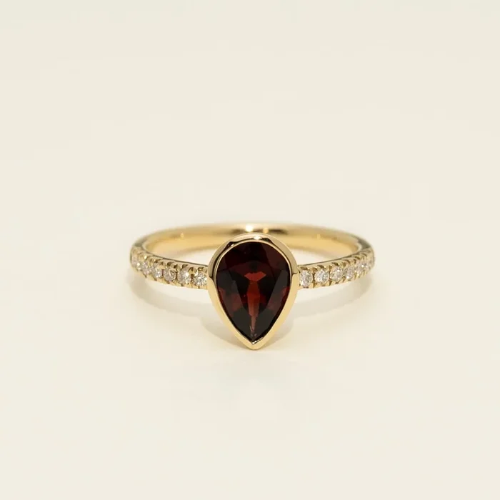 Pear Shape Garnet Bezel Ring in 14kt Yellow Gold with Diamonds (1/7ct tw)