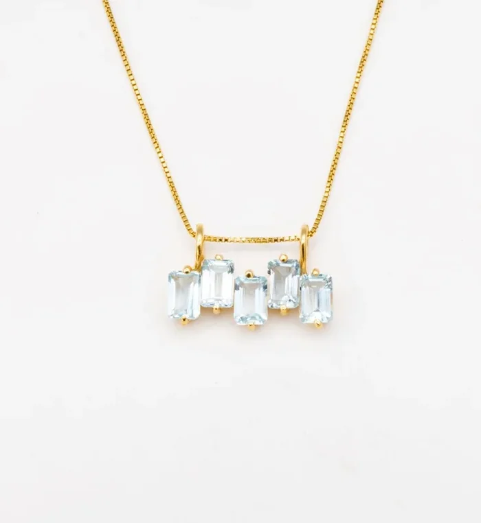 Staggered Blue Topaz Baguette Pendant in Gold
