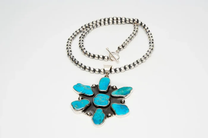 Sterling Silver Flower Pendant with Sleeping Beauty Turquoise