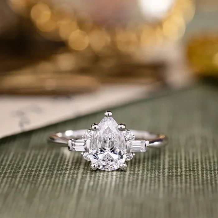 The Juno – Pear-Shaped Diamond Engagement Ring with Straight Baguette and Round Diamond Accents