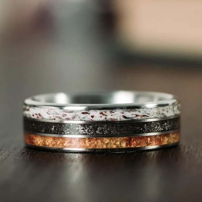 The Last Frontier | Men’s Titanium Wedding Band with Elk Antler, Meteorite Dust, & Fossilized Amber